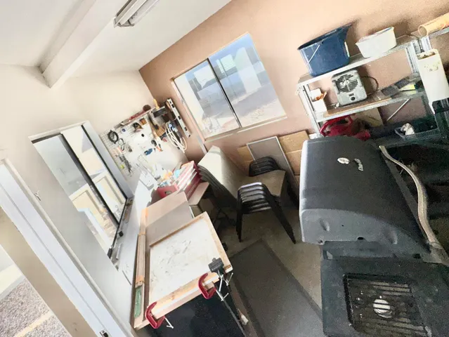 a spacious bedroom with two beds and lamp