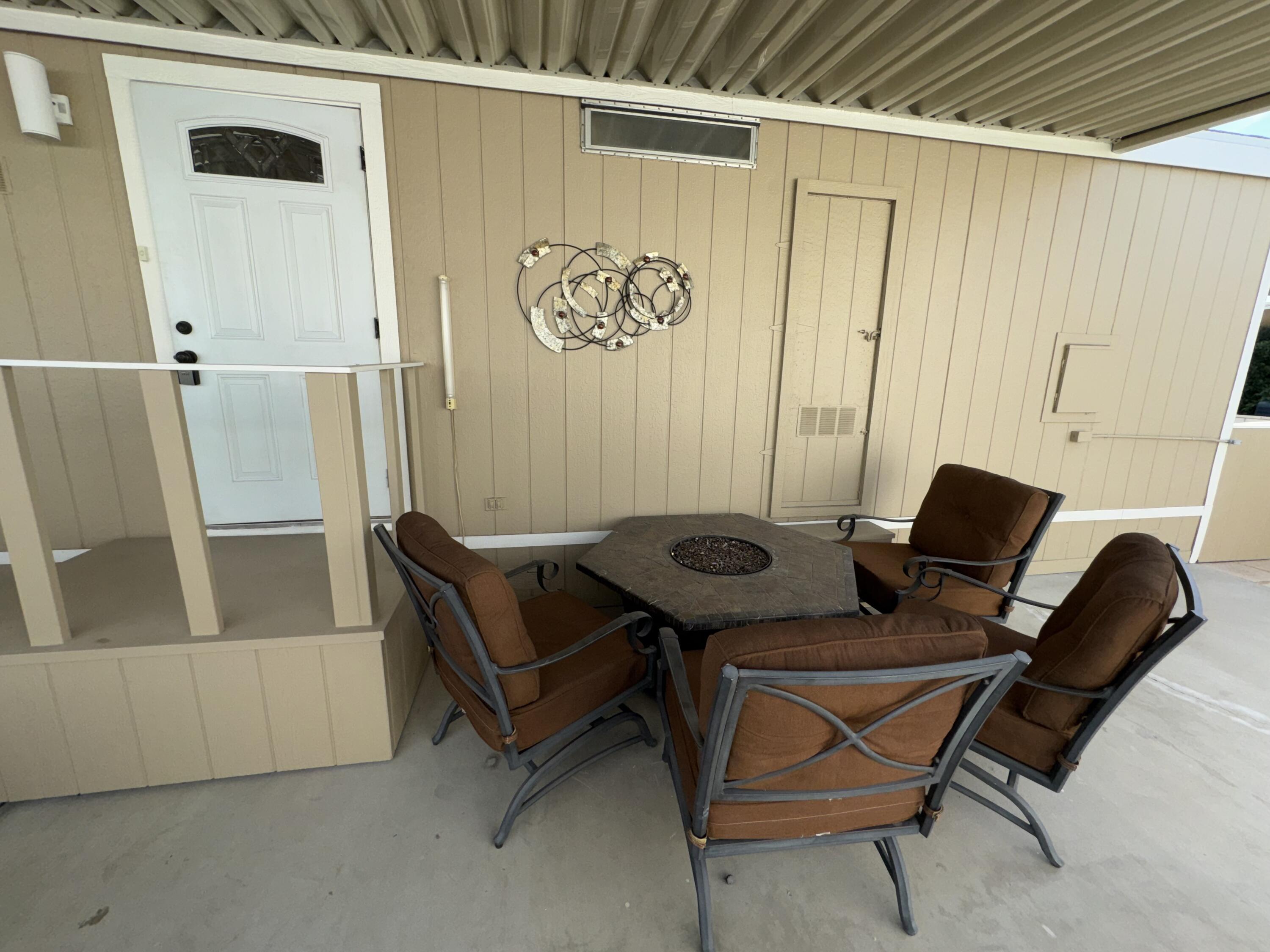 46618 Madison Street, Unit 153 Indio, CA 92201 - Photo 20 of 47 Back door/ Fire pit