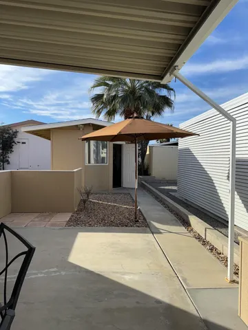 a table and chairs in a patio