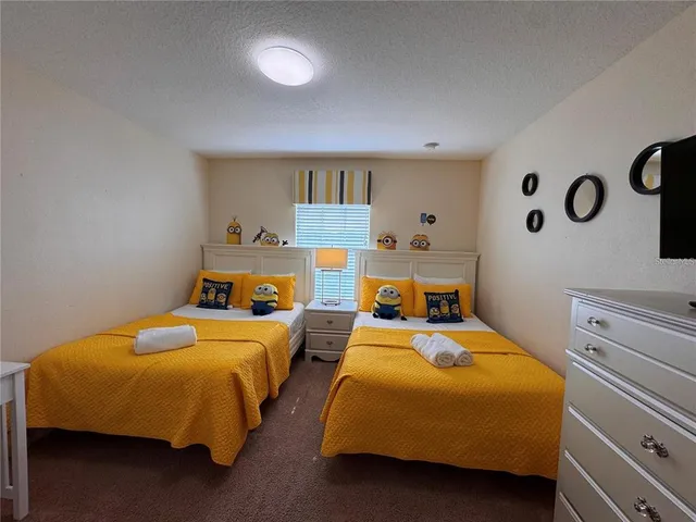 a bathroom with a granite countertop sink a light fixture and a mirror