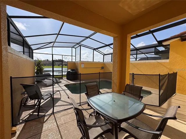 a patio with table and chairs