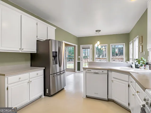 a view of storage and utility room with washer and dryer