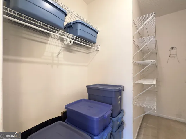 a spacious bathroom with a double vanity sink and a mirror