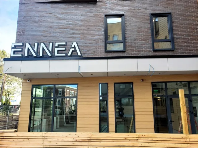 a street sign on the side of a building