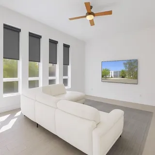 a living room with furniture and a large window