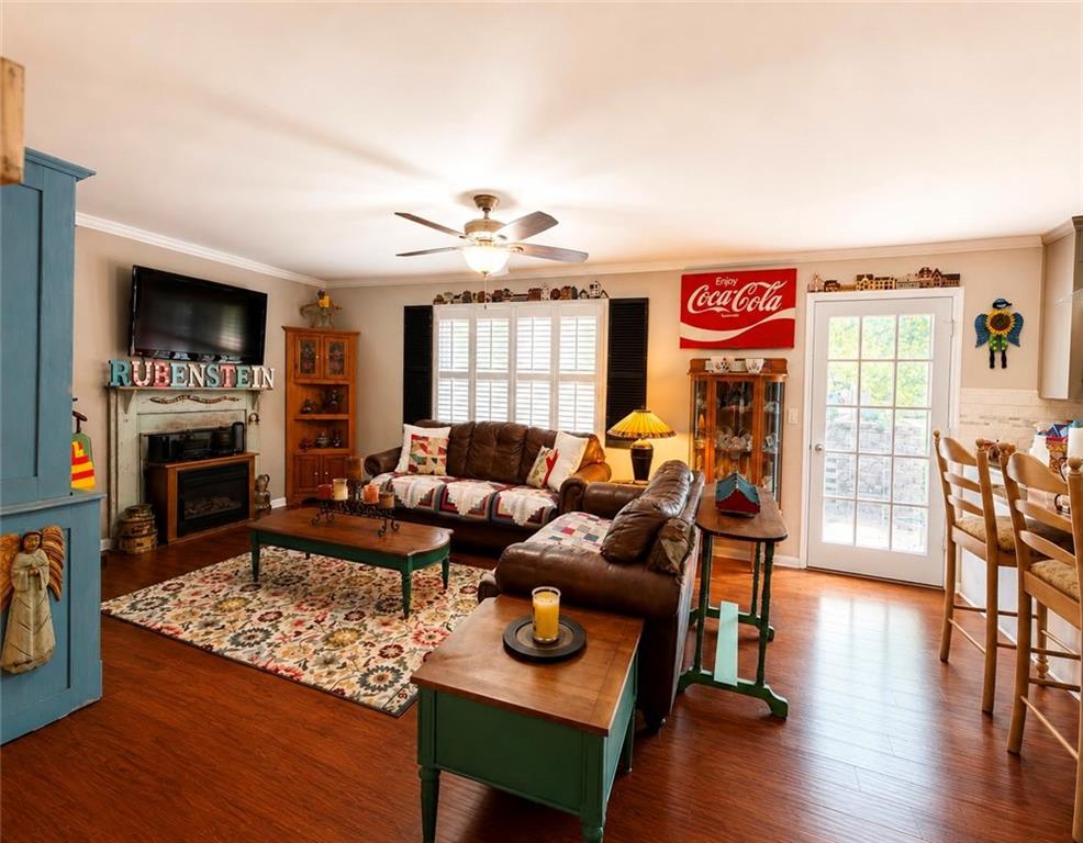 225 Pineridge Road Bogart, GA 30622 - Photo 22 of 53 a living room with furniture and a fireplace