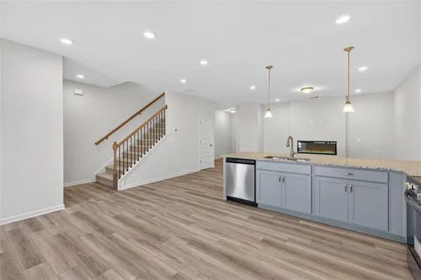 a view of kitchen with sink and microwave
