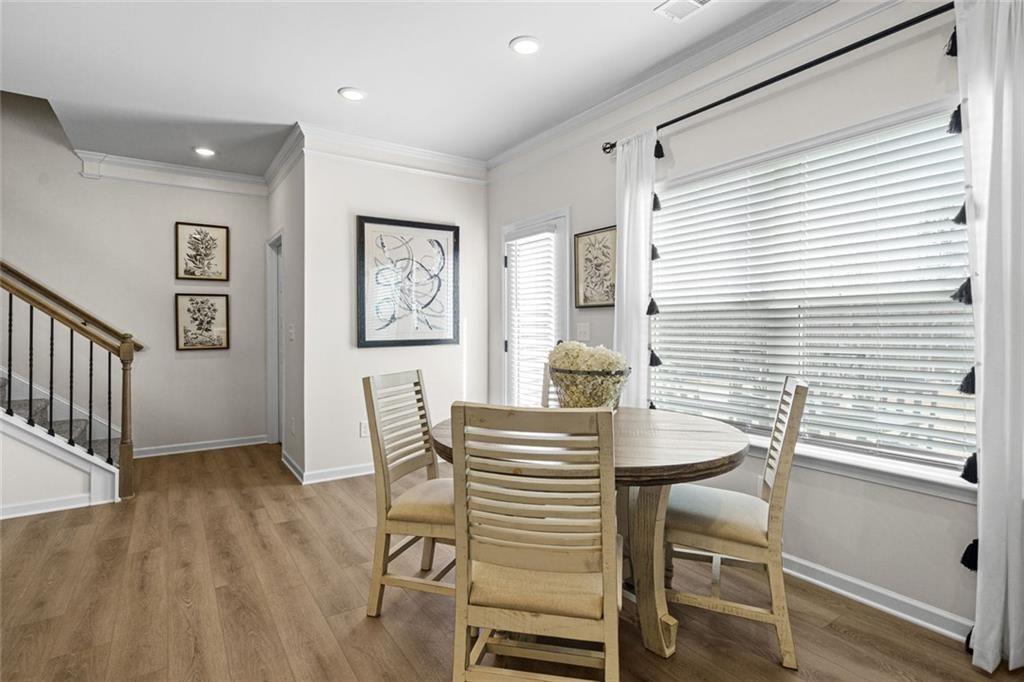 312 Caroline Place, Unit 99 Villa Rica, GA 30180 - Photo 14 of 24 a view of a dining room with furniture and wooden floor