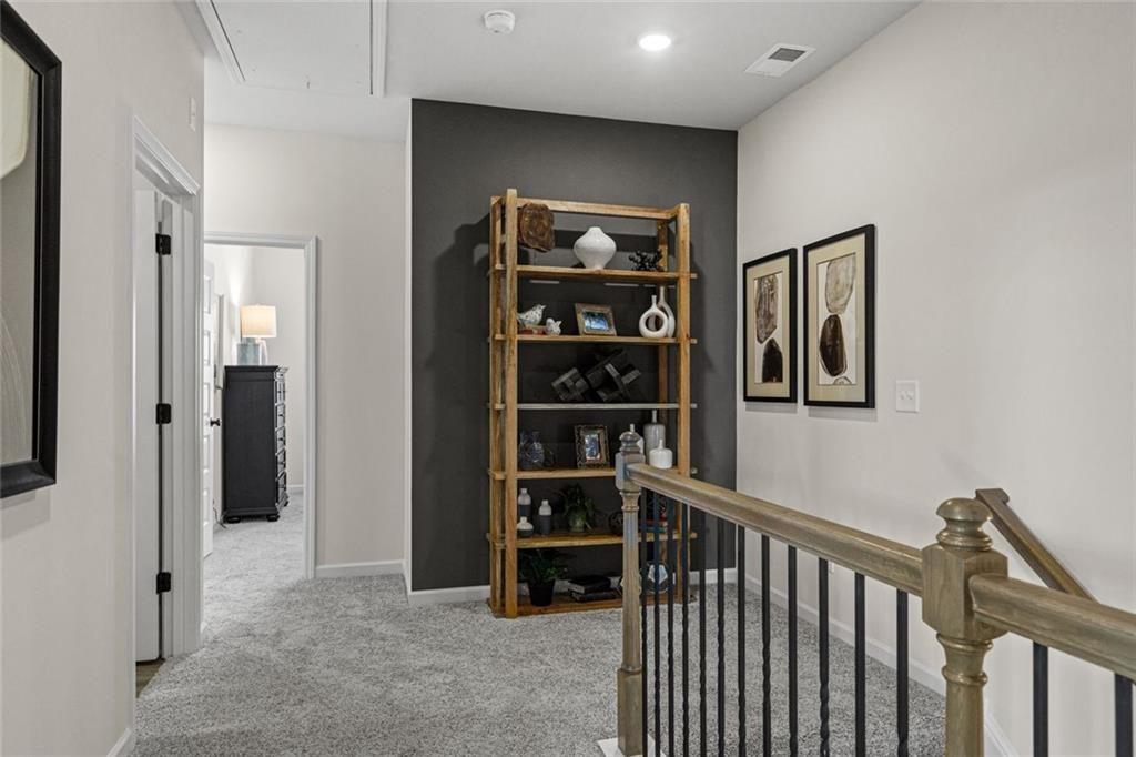 312 Caroline Place, Unit 99 Villa Rica, GA 30180 - Photo 18 of 24 a view of a hallway with wooden floor and closet