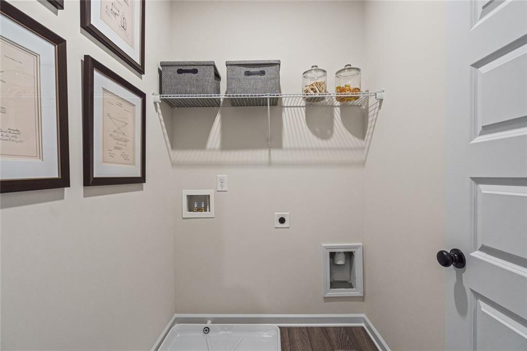 312 Caroline Place, Unit 99 Villa Rica, GA 30180 - Photo 19 of 24 a bathroom with a sink and mirror