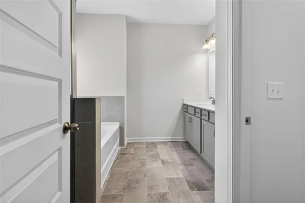 a view of a bathroom from a hallway