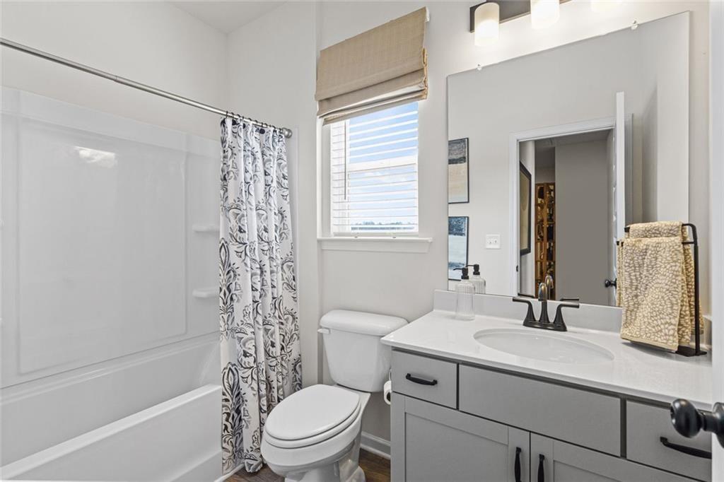 312 Caroline Place, Unit 99 Villa Rica, GA 30180 - Photo 24 of 24 a bathroom with a sink toilet vanity and tub