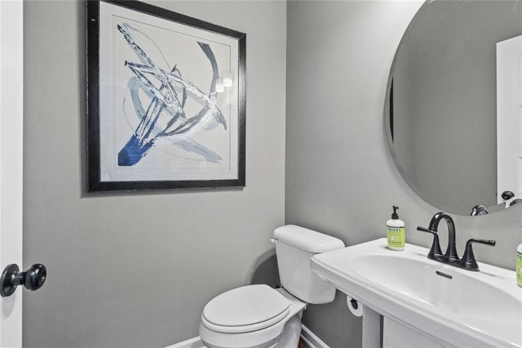 312 Caroline Place, Unit 99 Villa Rica, GA 30180 - Photo 4 of 24 a bathroom with a toilet and a sink