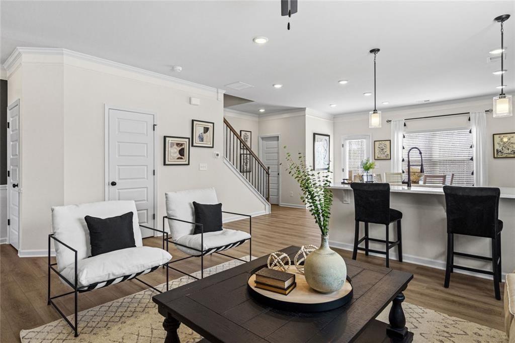 312 Caroline Place, Unit 99 Villa Rica, GA 30180 - Photo 8 of 24 a living room with furniture and kitchen view