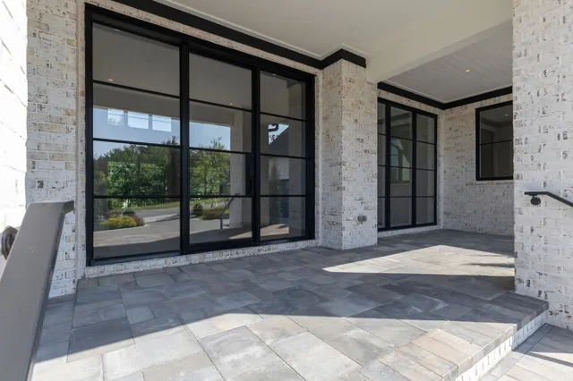 a kitchen with granite countertop a sink and a stove