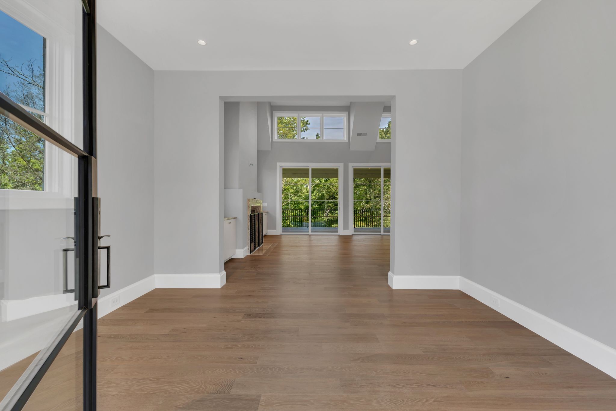 7577 Whiskey Road College Grove, TN 37046 - Photo 16 of 93 a view of an empty room with wooden floor and a window