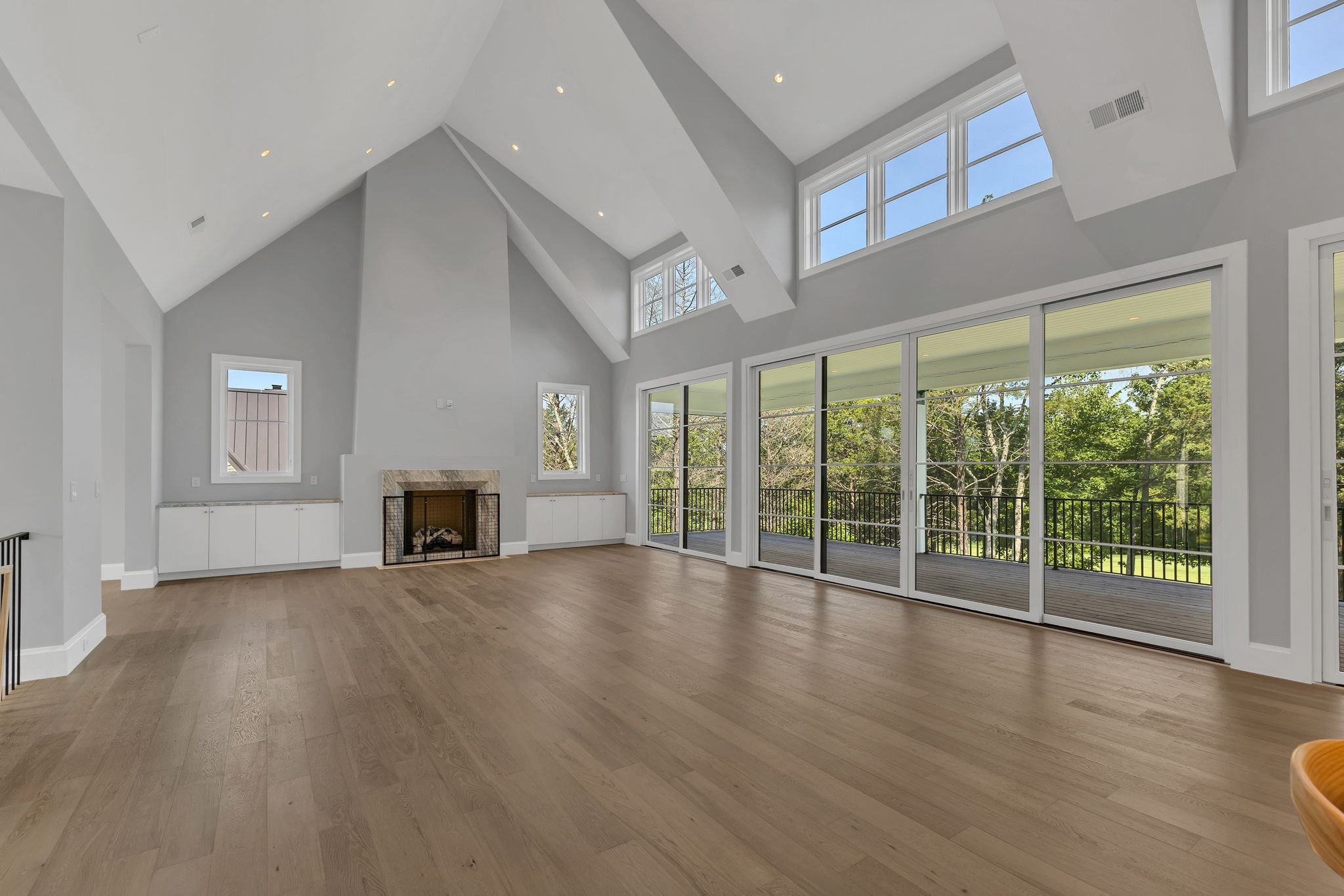 7577 Whiskey Road College Grove, TN 37046 - Photo 20 of 93 a view of an empty room with wooden floor and a window