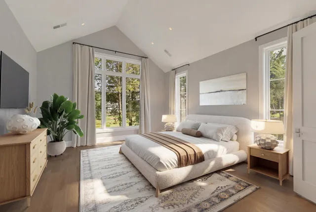 a view of an empty room with wooden floor and closet