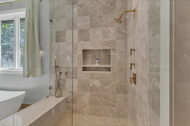 a living room with a flat screen tv and a window