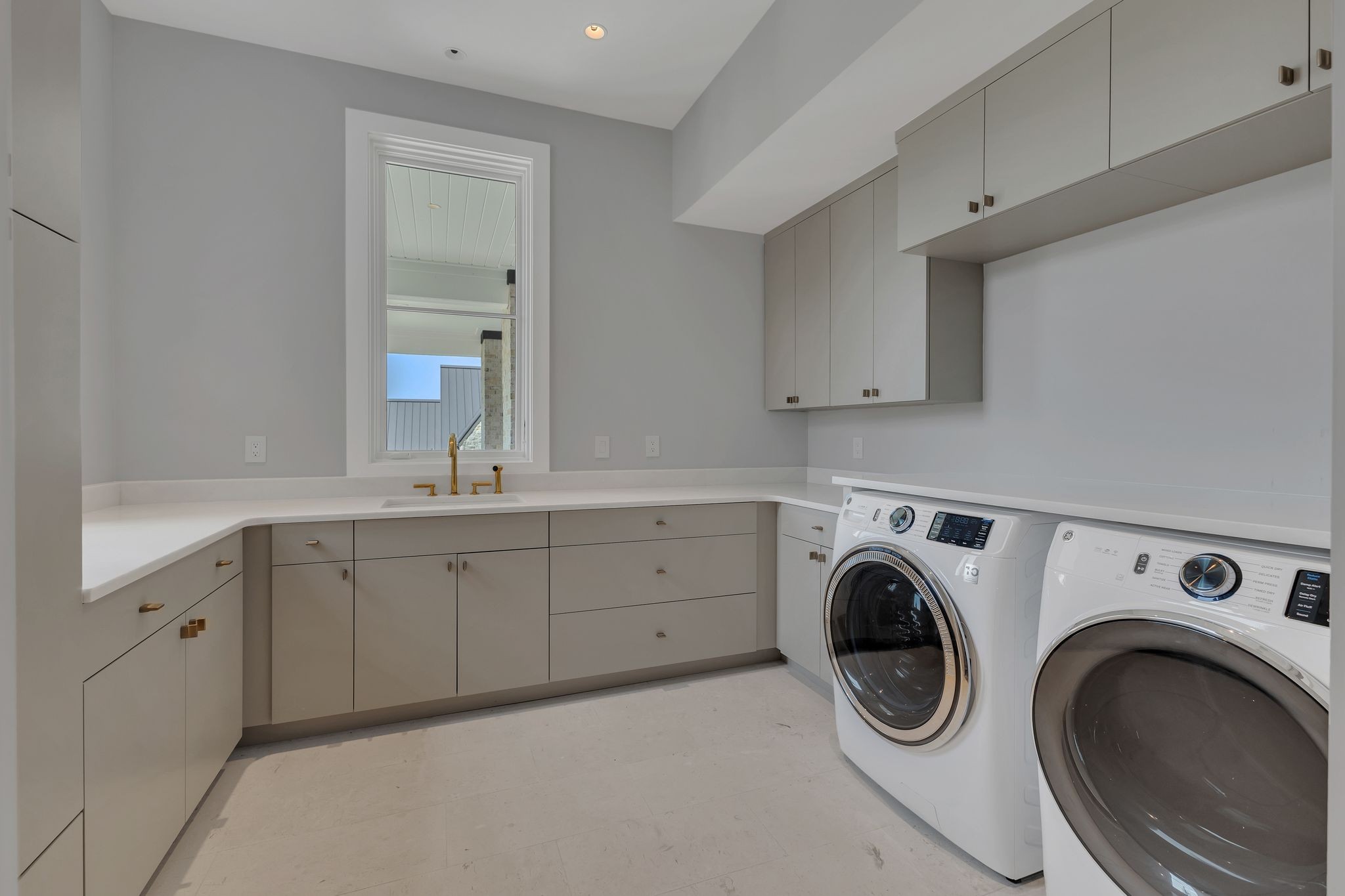 7577 Whiskey Road College Grove, TN 37046 - Photo 35 of 93 a spacious bathroom with 2 sink and a washer dryer