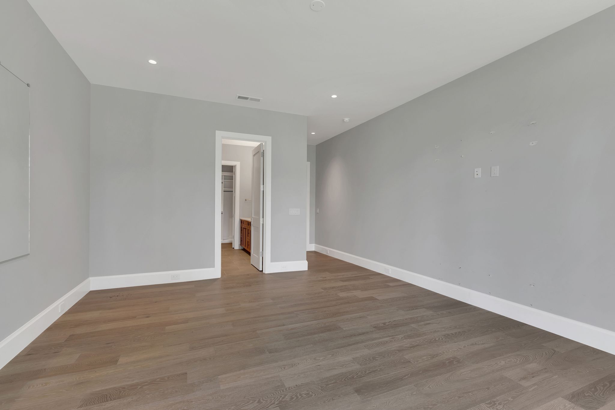 7577 Whiskey Road College Grove, TN 37046 - Photo 45 of 93 a view of an empty room with wooden floor and closet