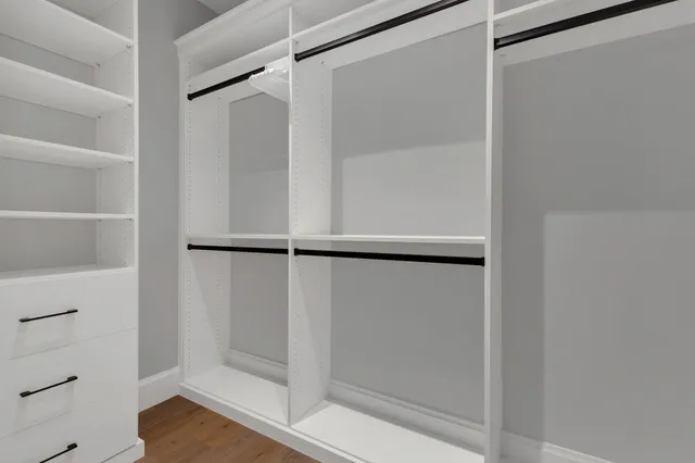 a view of a city with lush green forest