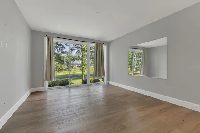a view of a garden with mountains in the background
