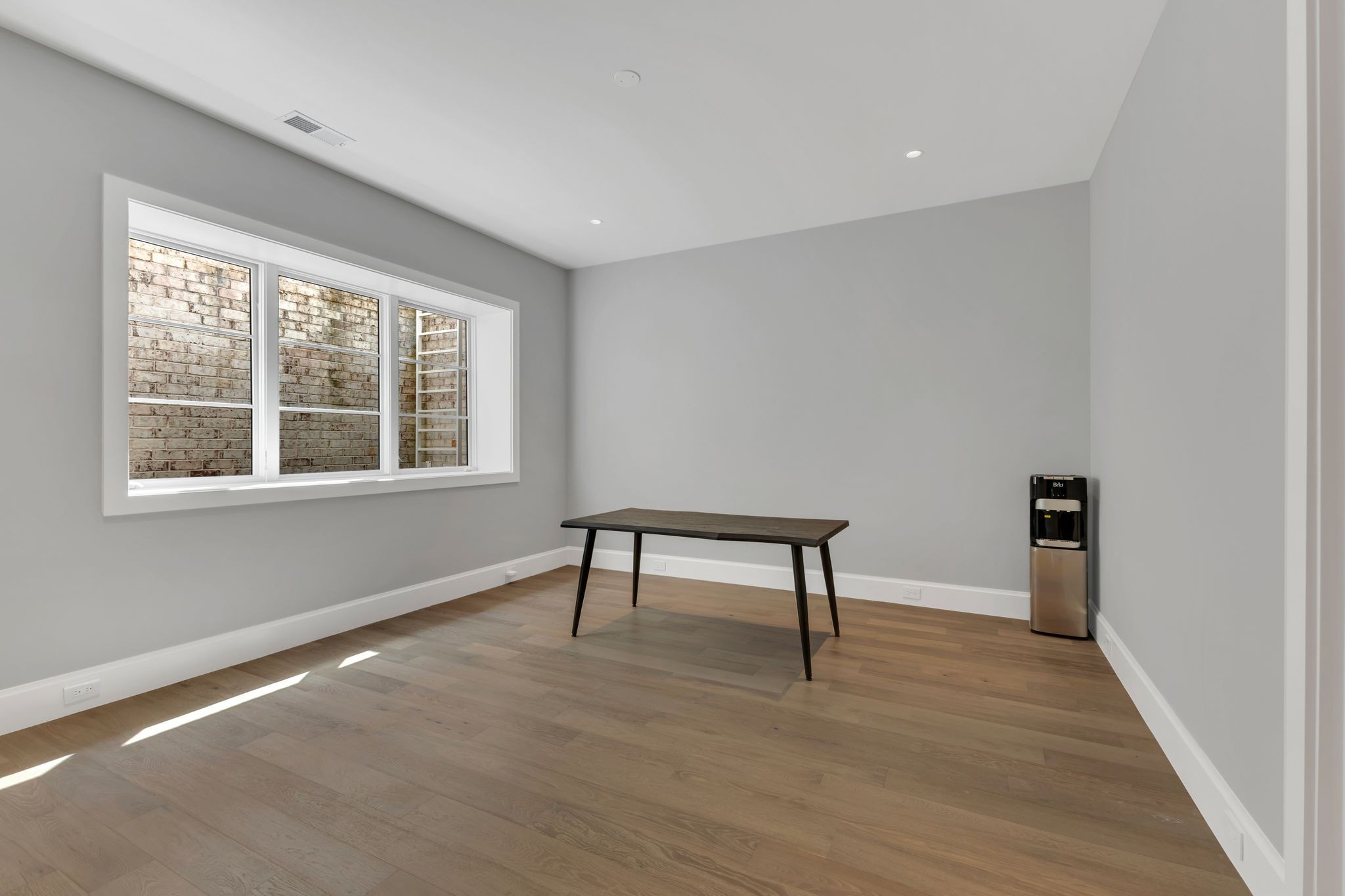 7577 Whiskey Road College Grove, TN 37046 - Photo 49 of 93 a view of an empty room with wooden floor and a window