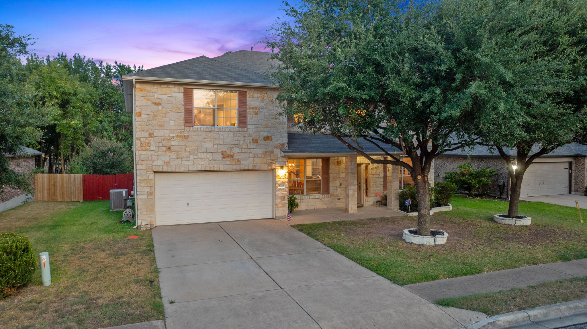 1024 Portchester Castle Path Pflugerville, TX 78660 - Photo 1 of 40 a front view of a house with a yard and tree s