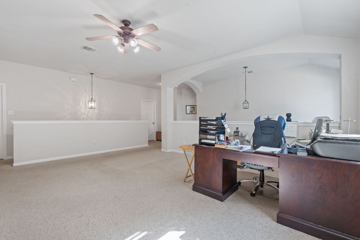 1024 Portchester Castle Path Pflugerville, TX 78660 - Photo 15 of 40 Office space with light carpet, ceiling fan, and arched walkways