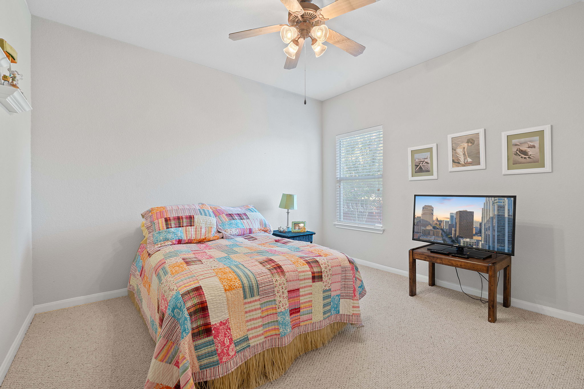 1024 Portchester Castle Path Pflugerville, TX 78660 - Photo 23 of 40 a bedroom with a bed and a lamp on a dresser