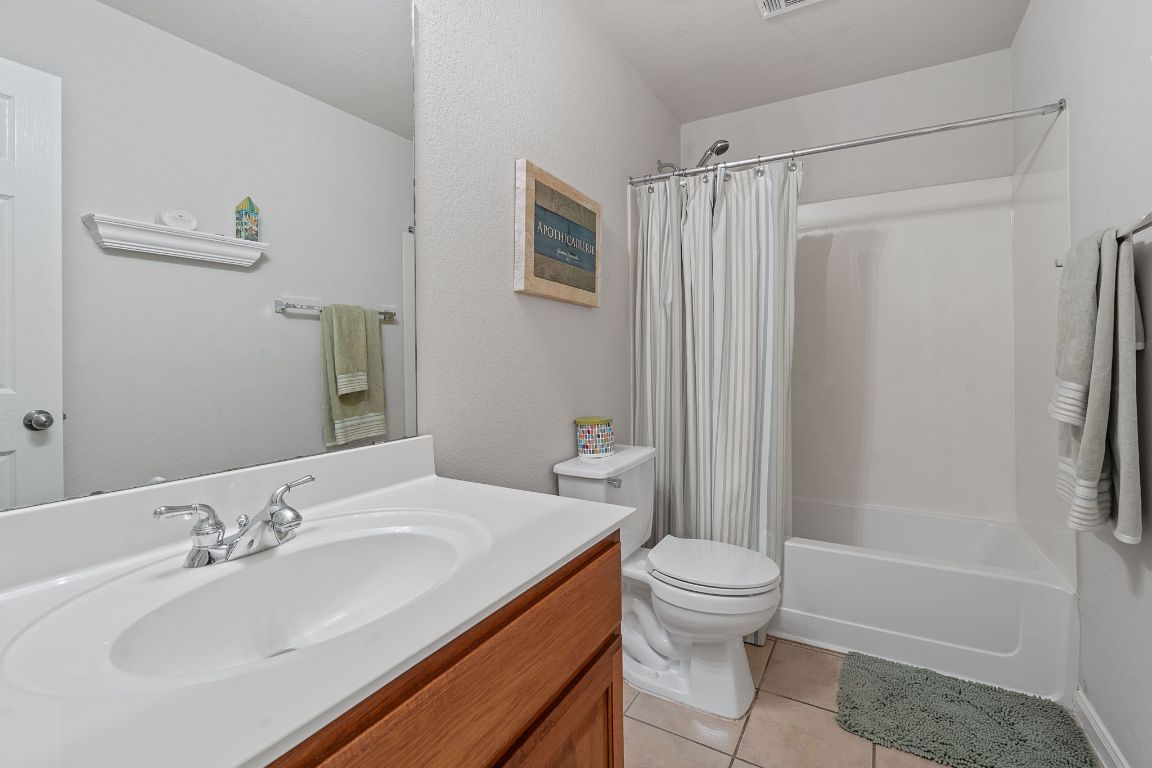 1024 Portchester Castle Path Pflugerville, TX 78660 - Photo 24 of 40 Full bathroom featuring light tile patterned floors, shower / tub combo, and vanity
