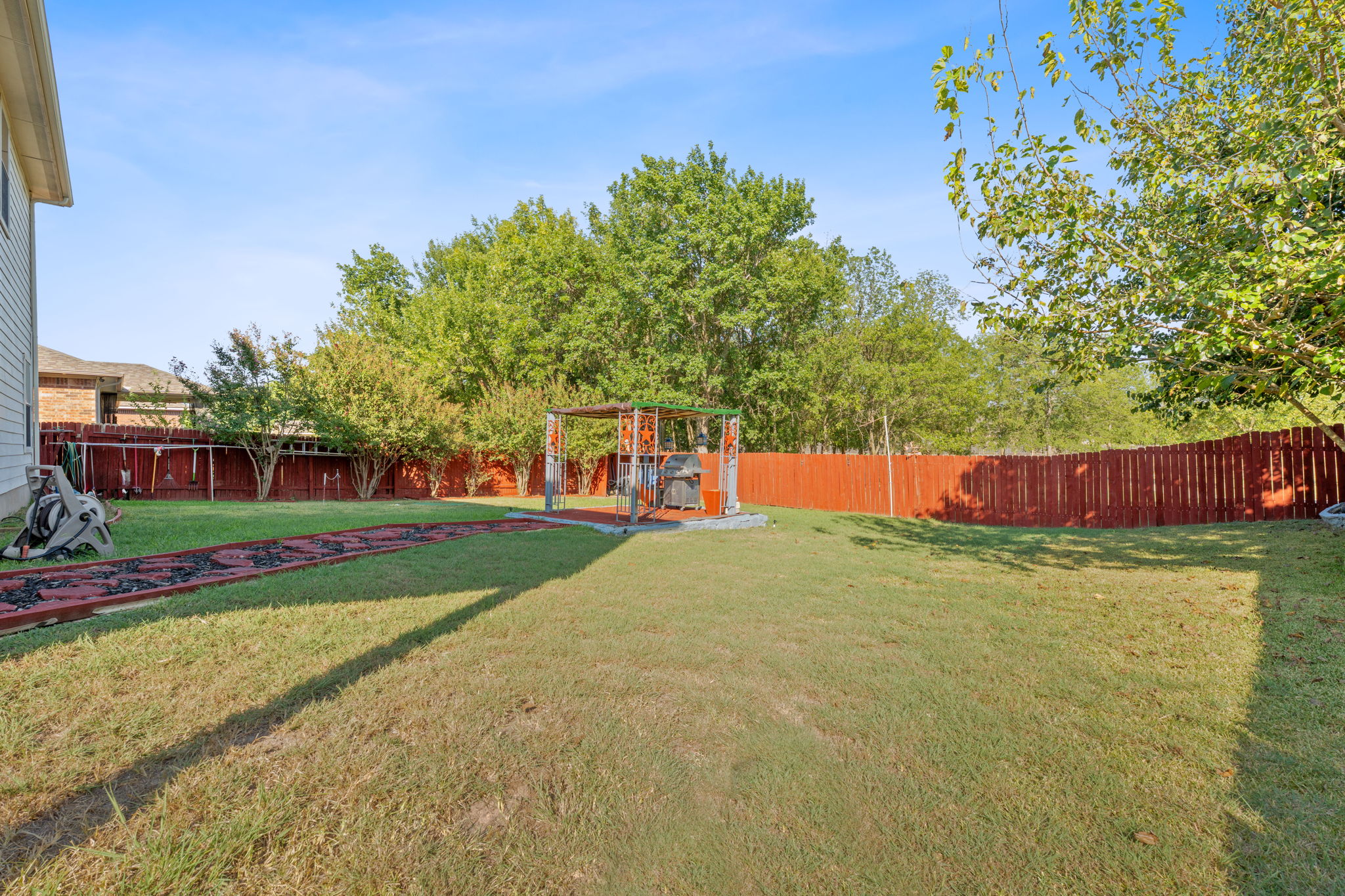 1024 Portchester Castle Path Pflugerville, TX 78660 - Photo 26 of 40 a view of a park with large trees and plants