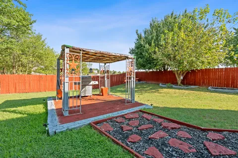 a view of a backyard with sitting area