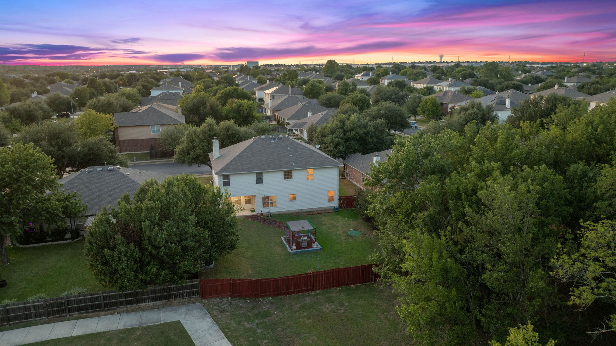 1024 Portchester Castle Path Pflugerville, TX 78660 - Photo 3 of 40 a view of a street with a yard in front of it
