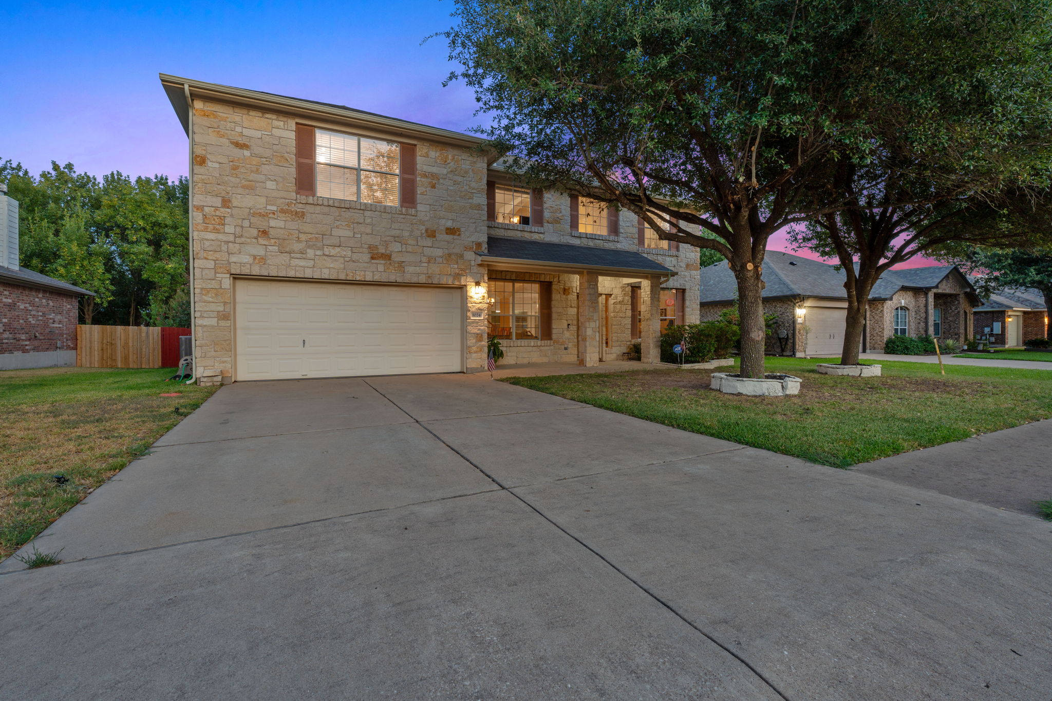 1024 Portchester Castle Path Pflugerville, TX 78660 - Photo 33 of 40 a front view of a house with a yard and trees