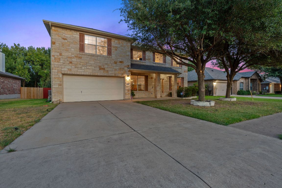 1024 Portchester Castle Path Pflugerville, TX 78660 - Photo 33 of 40 Traditional home featuring covered porch, driveway, a garage, and stone siding