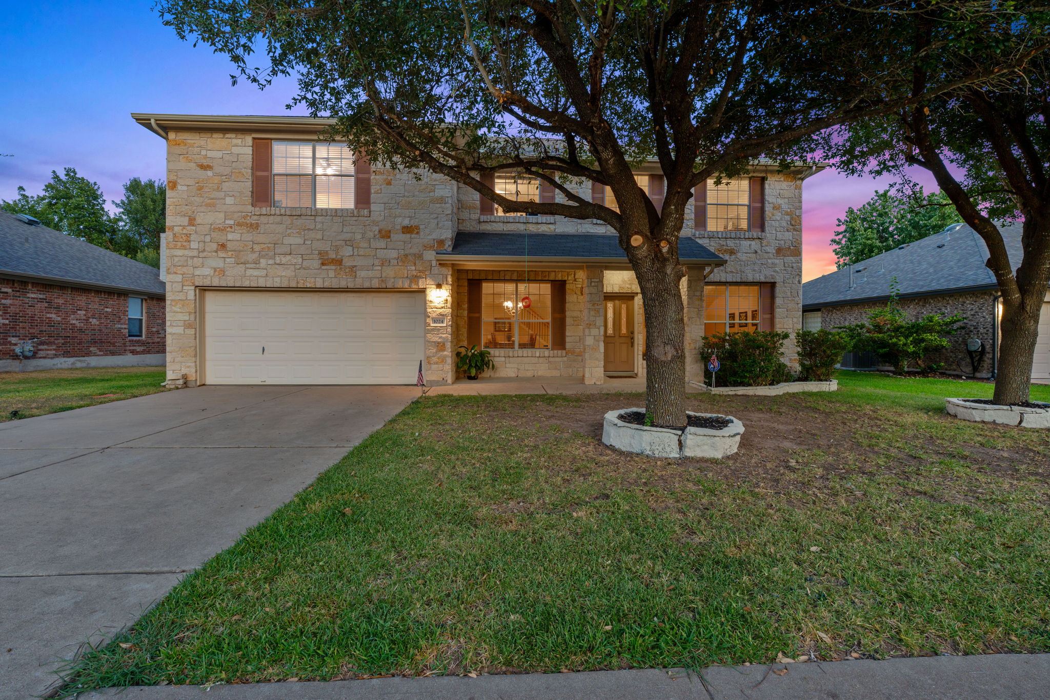 1024 Portchester Castle Path Pflugerville, TX 78660 - Photo 34 of 40 a front view of a house with garden and trees