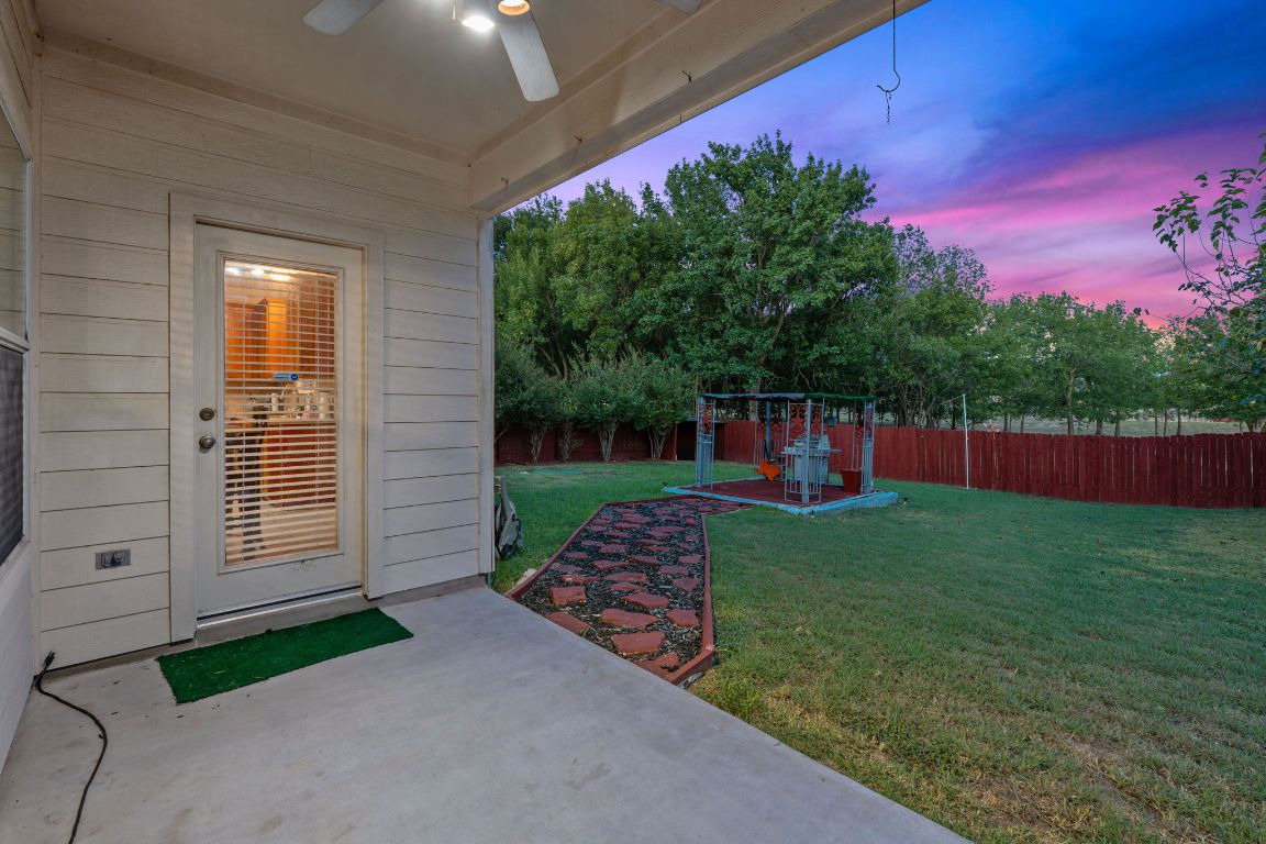 1024 Portchester Castle Path Pflugerville, TX 78660 - Photo 35 of 40 Fenced backyard with a patio and ceiling fan