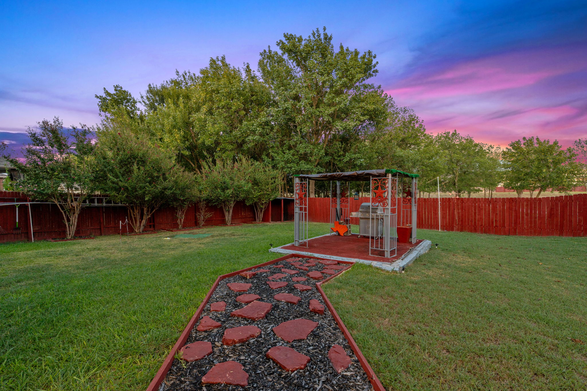 1024 Portchester Castle Path Pflugerville, TX 78660 - Photo 36 of 40 a view of a backyard with couches with wooden fence