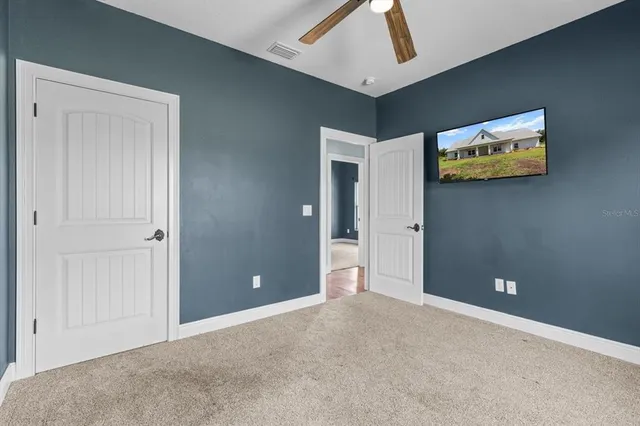 a view of an empty room with painted walls