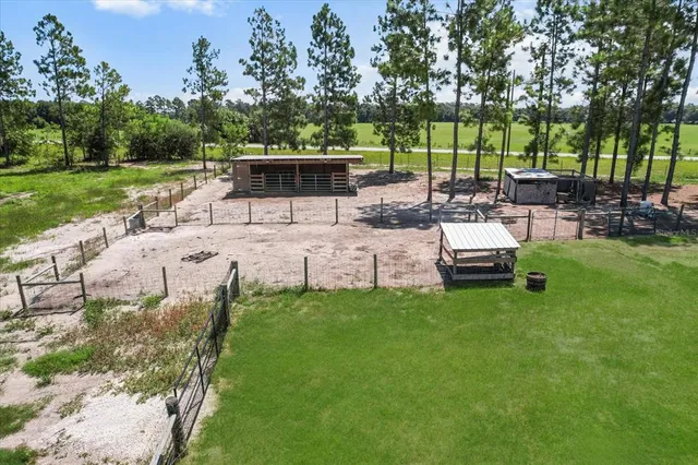 a view of a backyard with sitting area