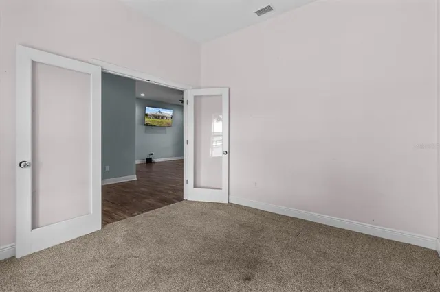 a view of a hallway with wooden shelves