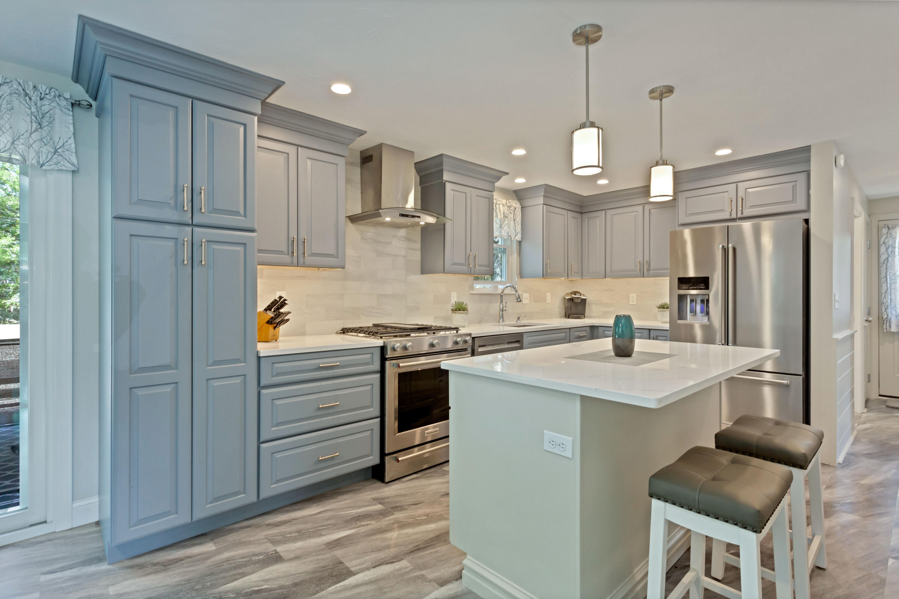 138 Gunstock Road Osterville, MA 02655 - Photo 11 of 47 a kitchen with a refrigerator a sink and cabinets