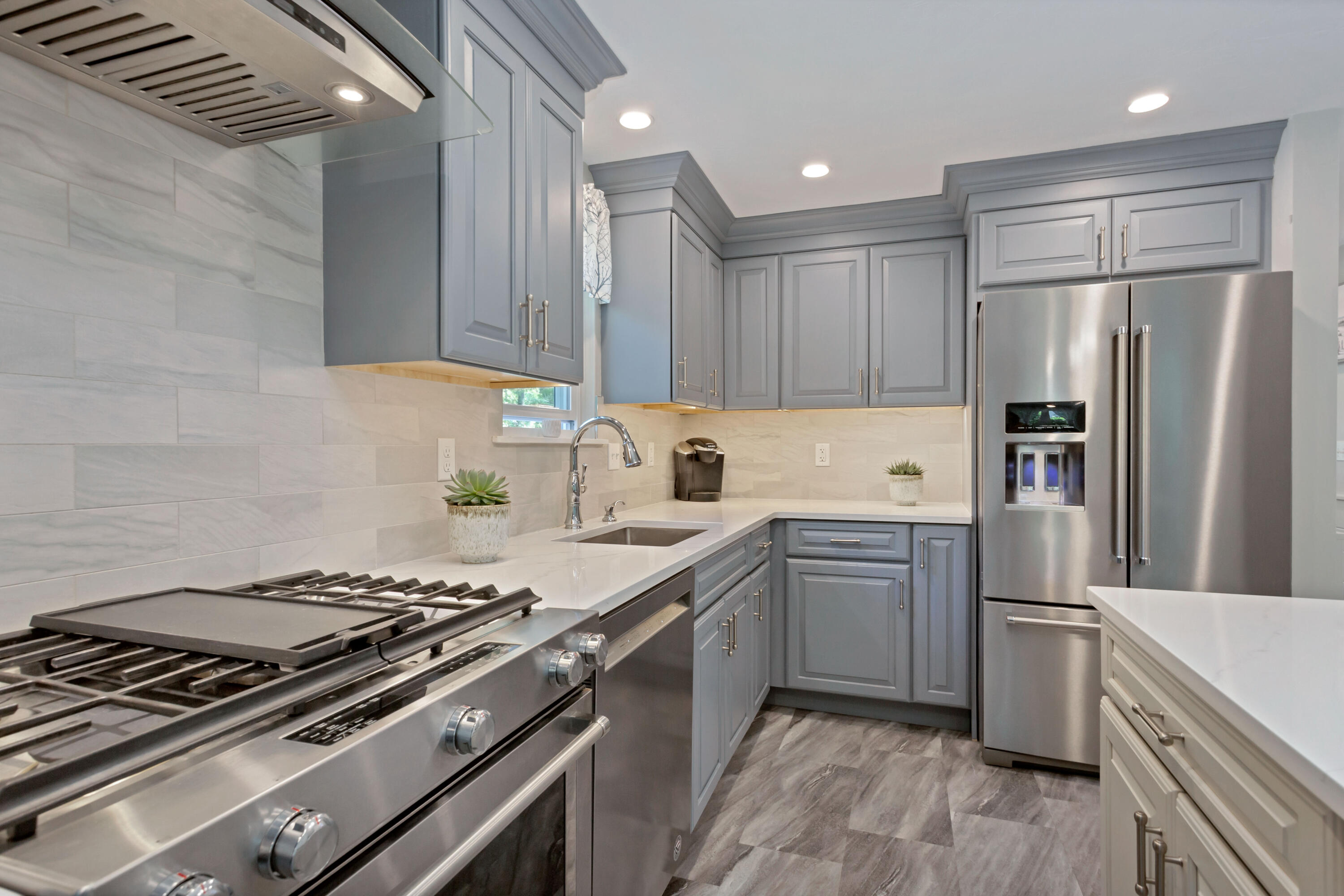 138 Gunstock Road Osterville, MA 02655 - Photo 13 of 47 a kitchen with a stove and a refrigerator