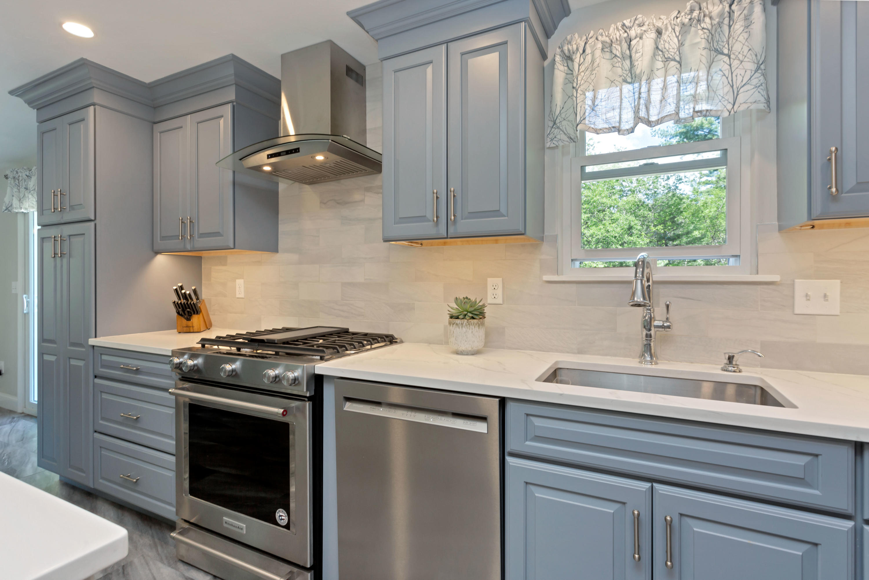 138 Gunstock Road Osterville, MA 02655 - Photo 15 of 47 a kitchen with stainless steel appliances a stove a sink and a window