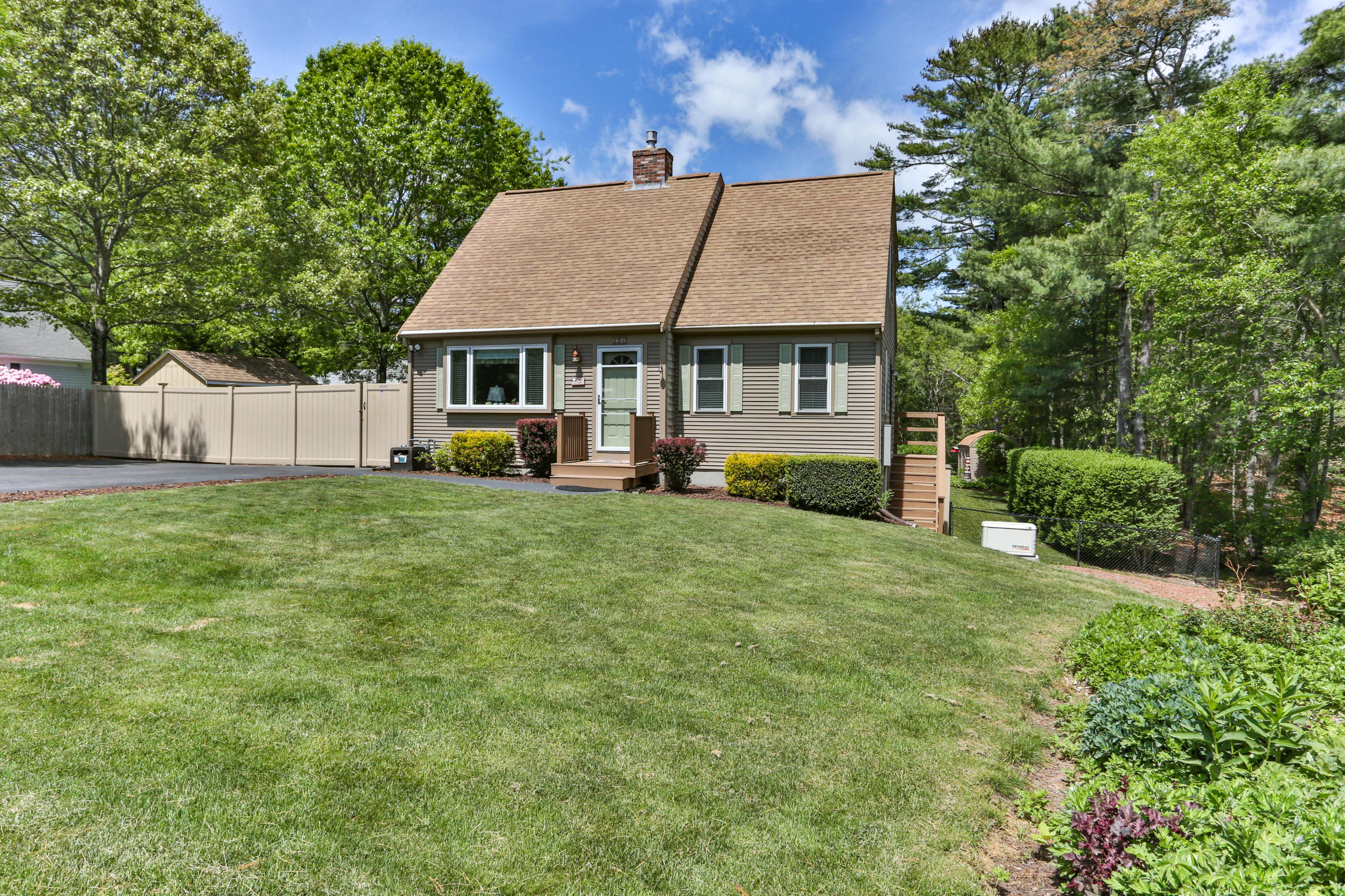 138 Gunstock Road Osterville, MA 02655 - Photo 2 of 47 front view of a house with a yard
