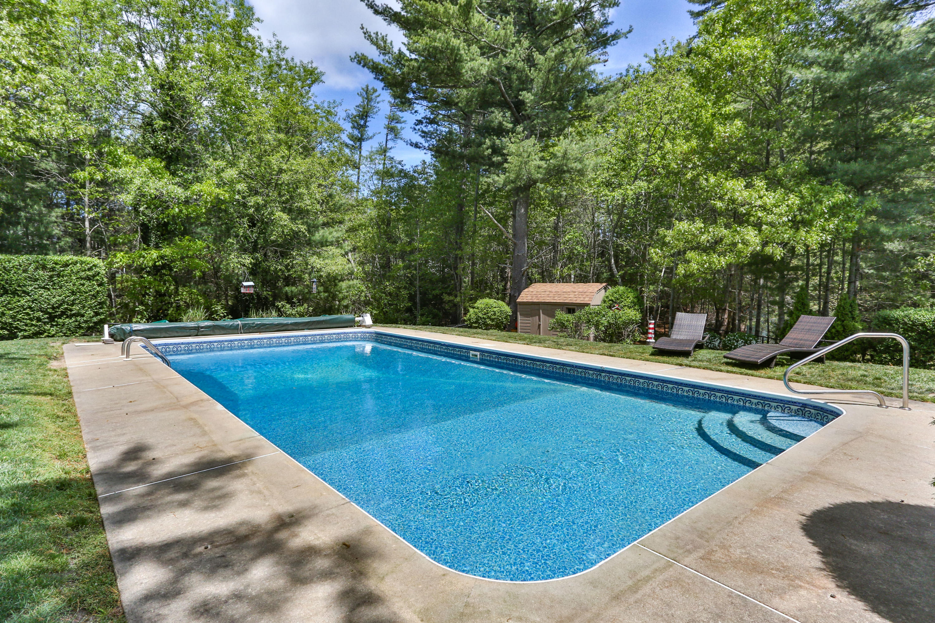 138 Gunstock Road Osterville, MA 02655 - Photo 32 of 47 a view of a swimming pool with a patio