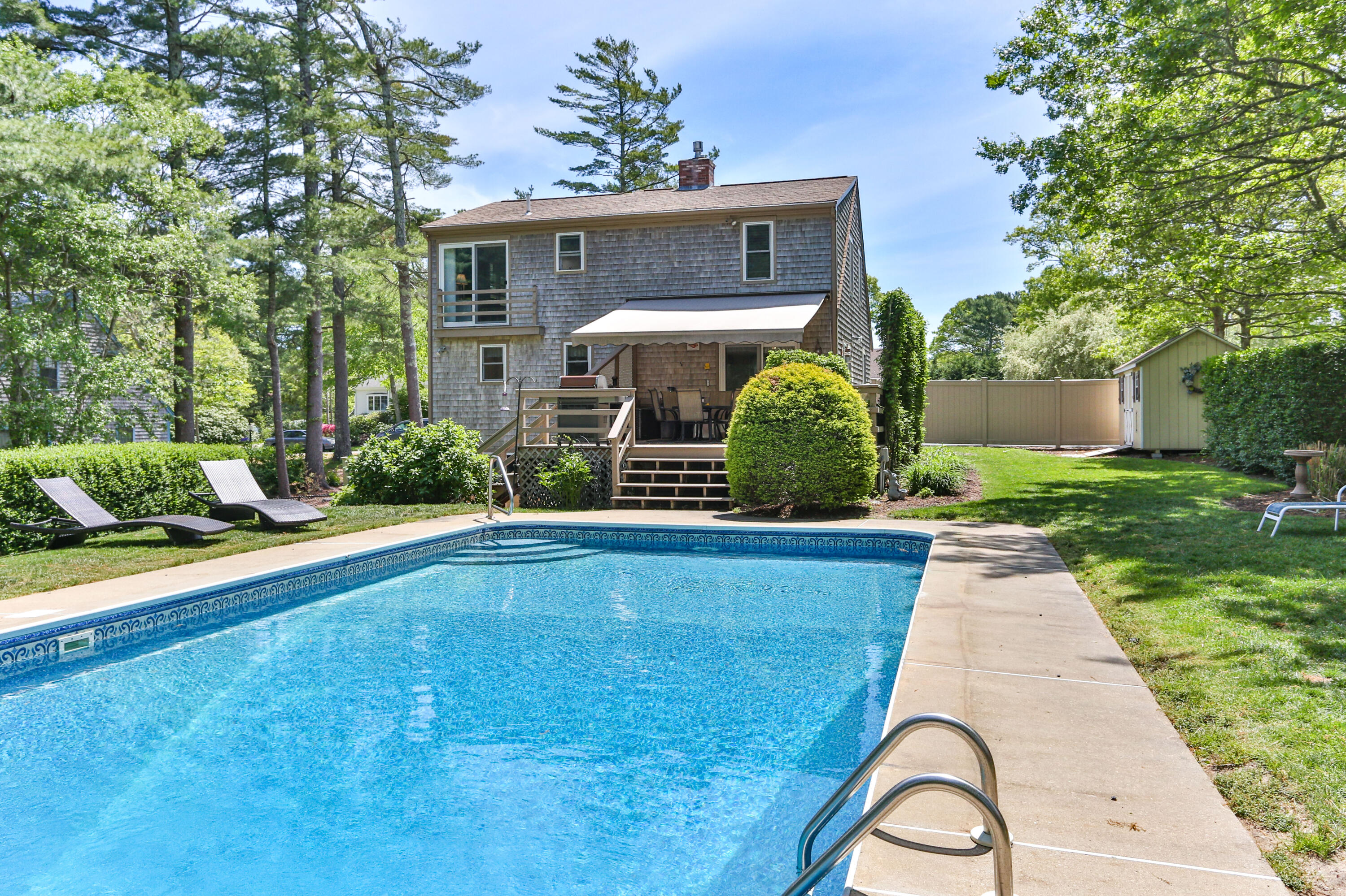 138 Gunstock Road Osterville, MA 02655 - Photo 35 of 47 a view of a house with a swimming pool