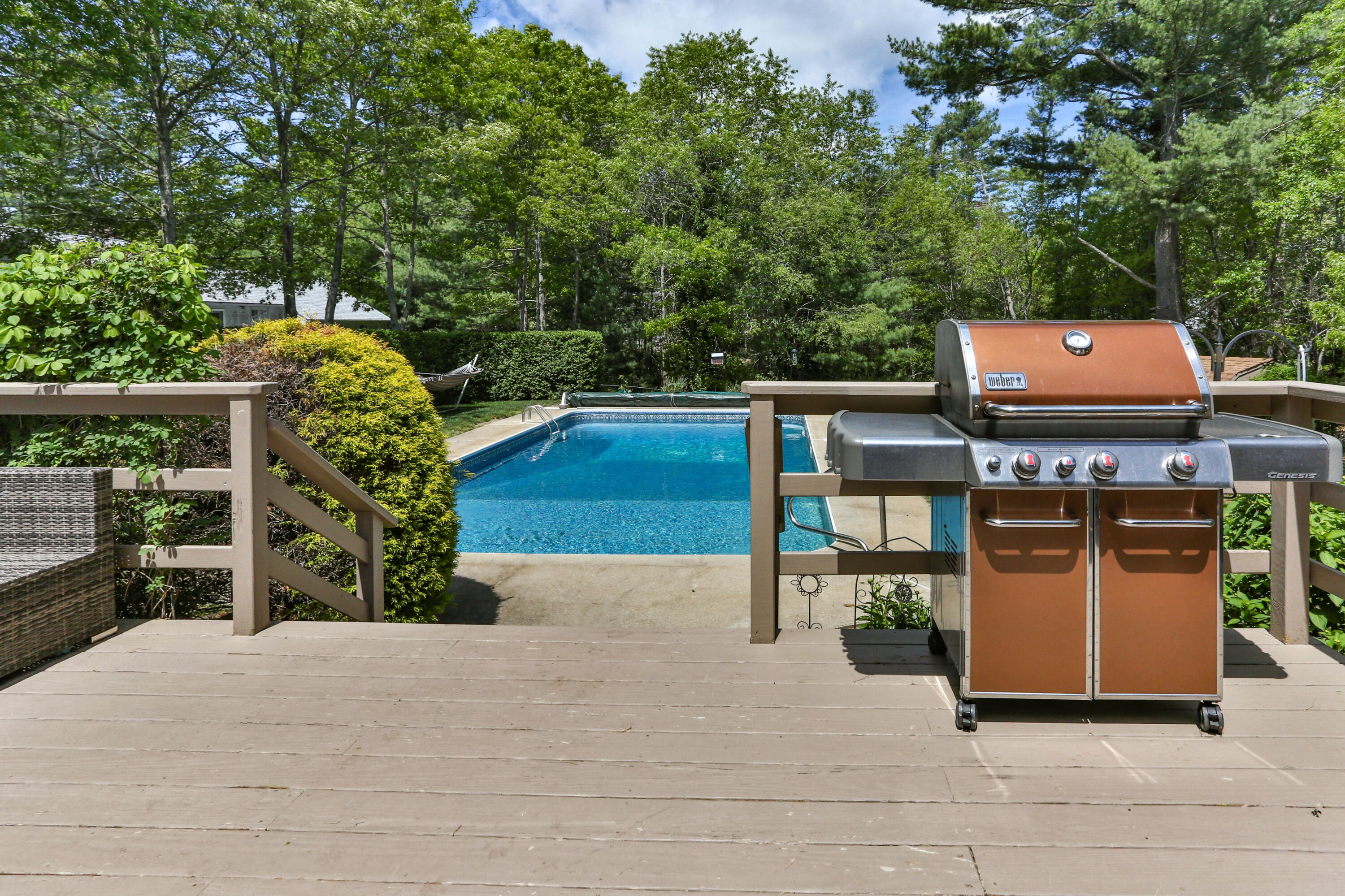 138 Gunstock Road Osterville, MA 02655 - Photo 36 of 47 a wooden bench sitting in front of a building